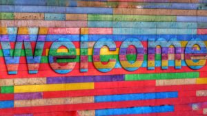 Welcome sign made of colourful blocks of wood.