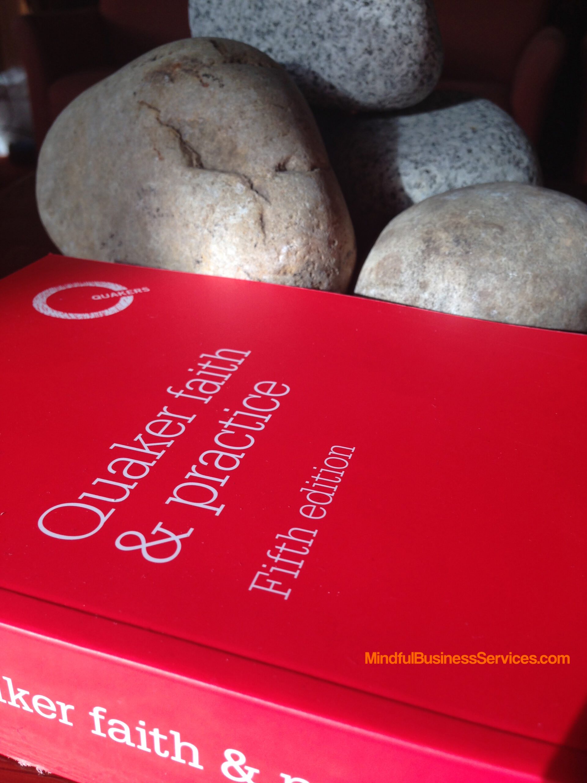 Quaker Faith & Practice with stones
