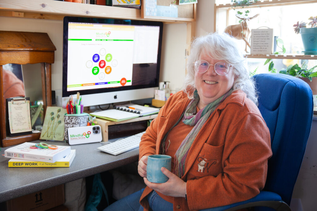 Wendrie Heywood at desk