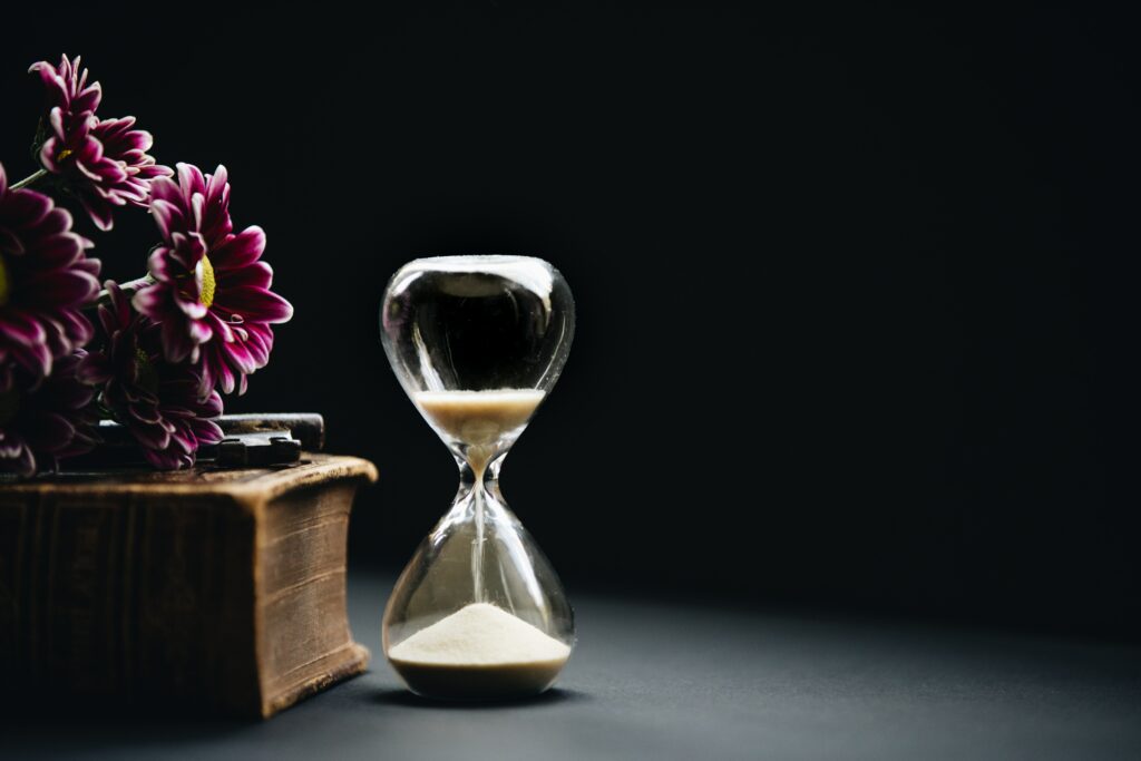 an hourglass with sand running
