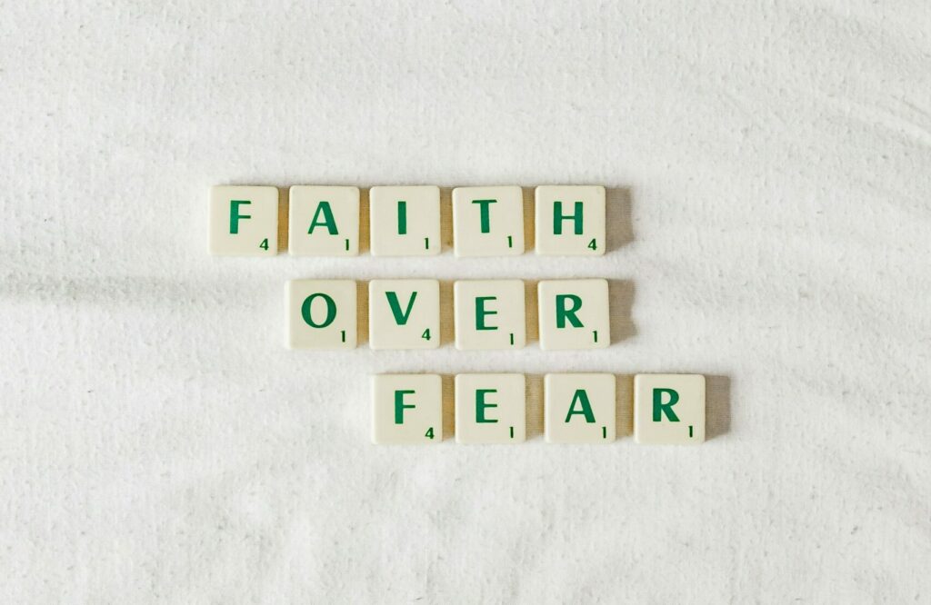 fear scrabble tiles saying, 'faith over fear'