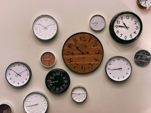 a wall of clocks all showing 10 o'clock