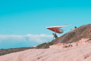 spirit hang glider launching from cliff top