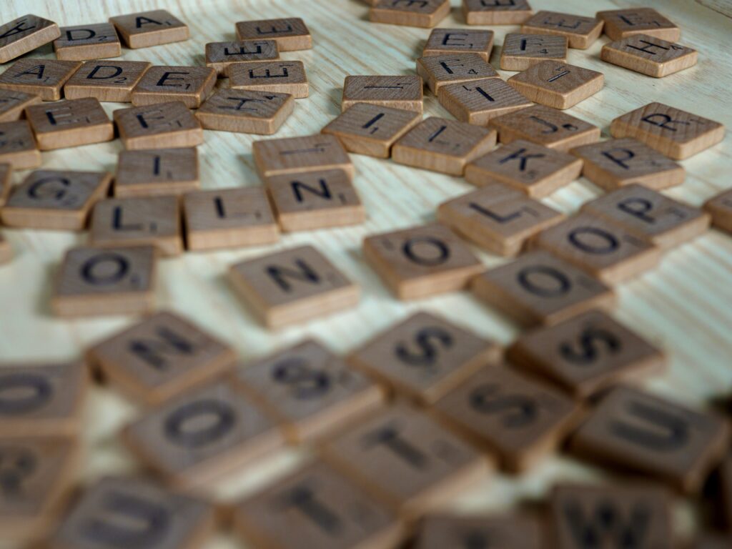 Scrabble tiles unorganised and not all in focus